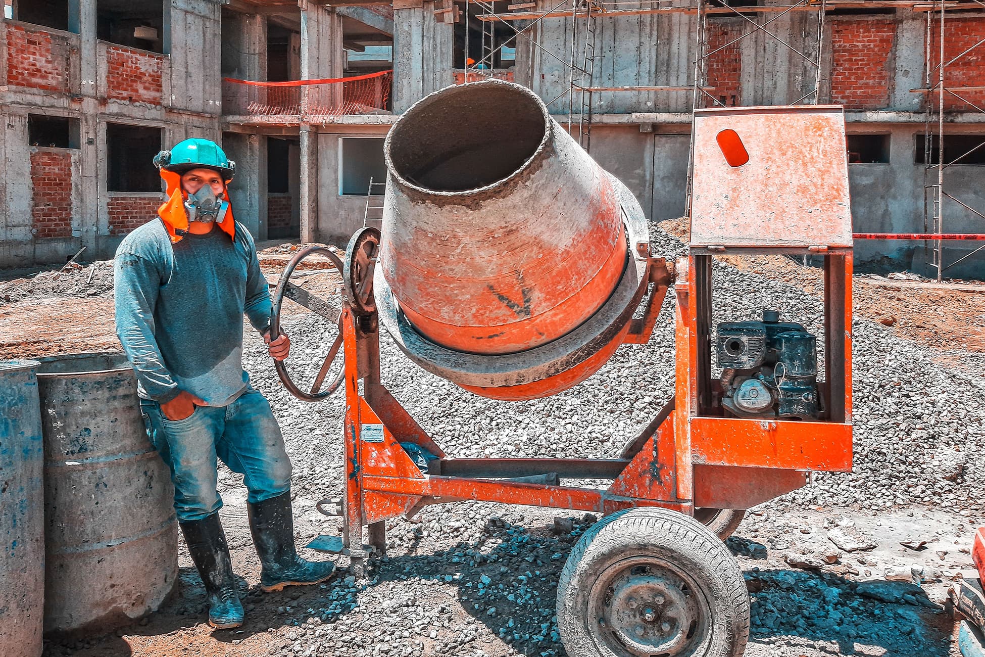 Construction rain boots covered in concrete during wet jobsite work