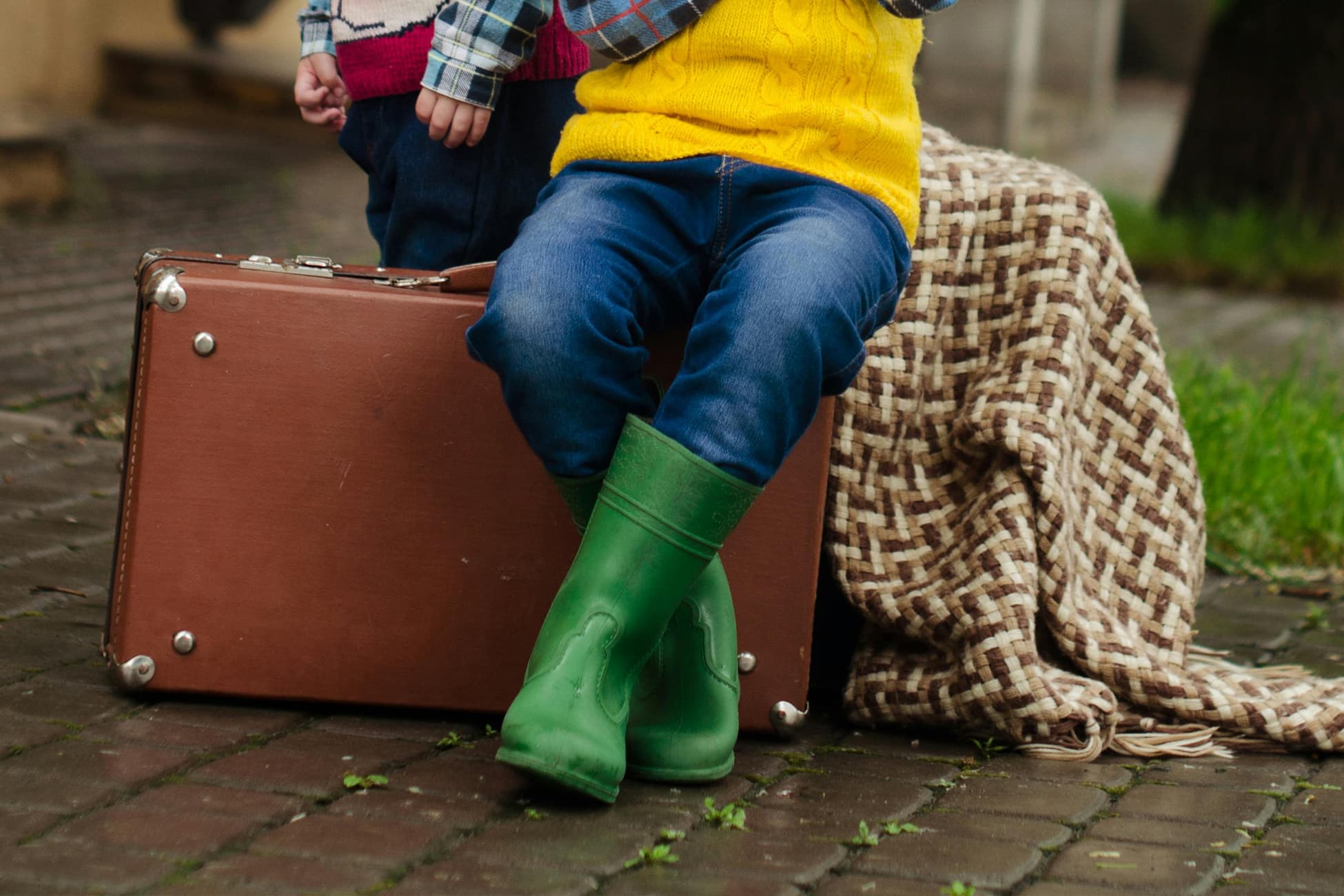 Children wearing rain boots for wet weather activities